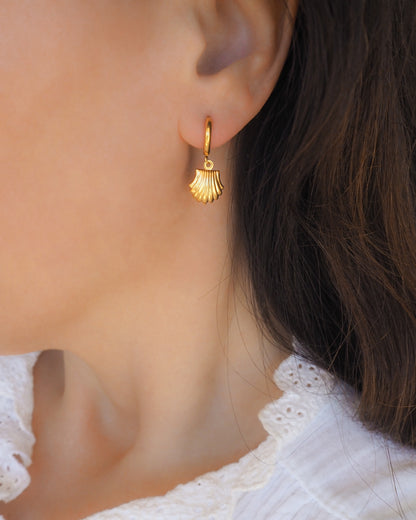 Gold Shell Earrings in ear model, gold seashell pendant earrings, waterproof