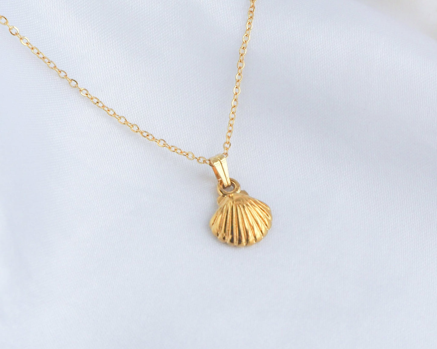 Gold tiny shell pendant necklace detailed view