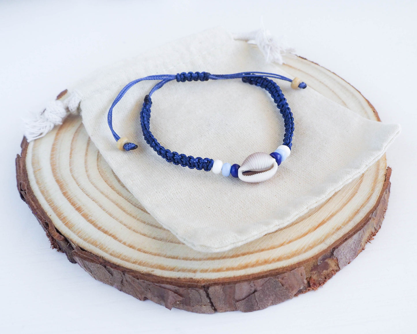 handmade cowrie sea shell bracelet Portugal, sea shell bracelet, seashell bracelet, seashell jewelry, cowrie shell bracelet, seabylou, sea by lou, blue braided bracelet, Cowrie Shell Bracelet, Trivia monacha 