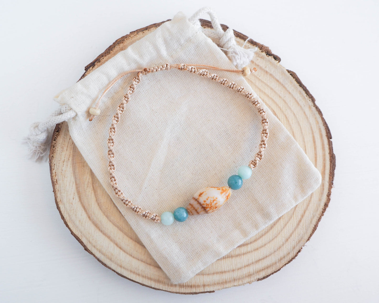 Unique Seashell and Gemstone Bracelet: Rustic Dove Shell, Gold Cord, and Jade Beads