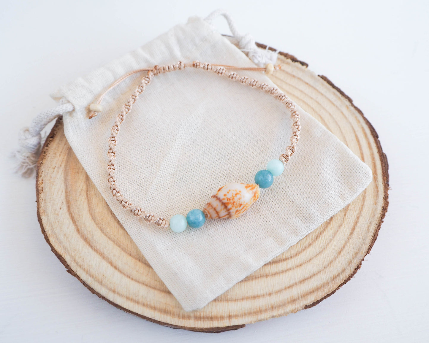 Chic Bracelet crafted from Rustic Dove Shell, Gold Braided Cord, and Jade Beads