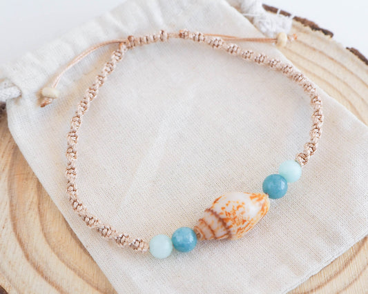 Close-up of Rustic Dove Shell Bracelet with Gold Braided Cord and Jade Beads