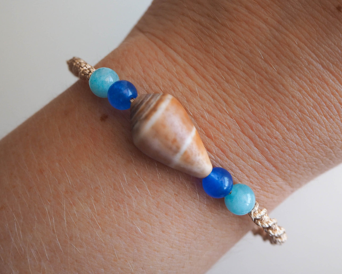 Beach Girl's Bracelet featuring Cone Shell, Gold Cord, and Aquamarine Beads