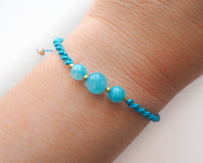 Model wearing Aquamarine Bead Braided Cord Bracelet, Tranquil Jewelry, Serene Aquamarine Bracelet, Ocean-Inspired Accessory