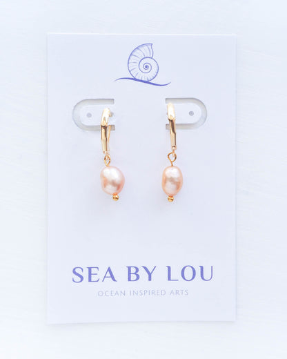 Chic in Pink: Rose Freshwater Pearls Suspended on Gleaming Gold Hooks