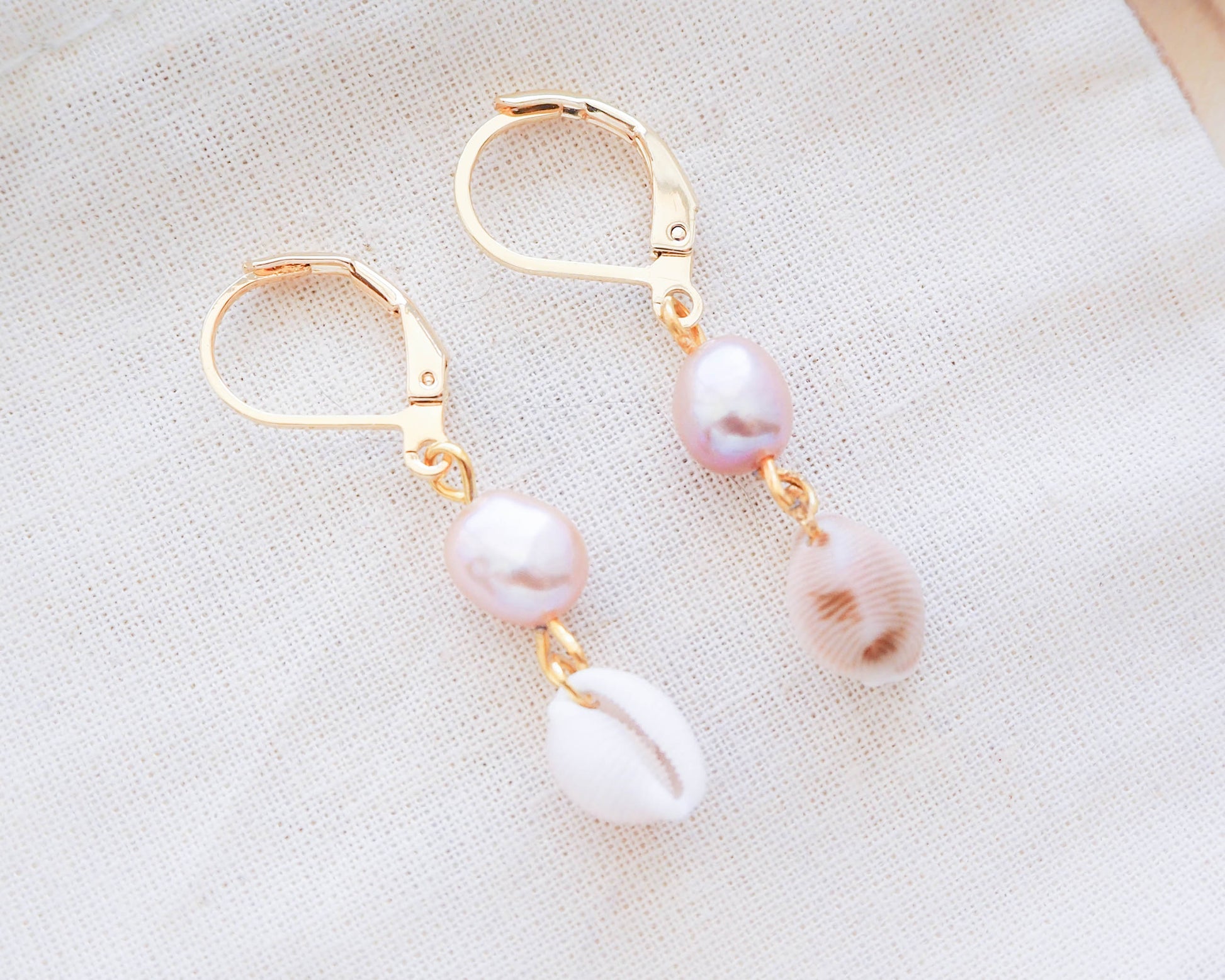 Close up of 24K Gold Plated Portuguese Cowrie Seashell Earrings with Rose Freshwater Pearls, Wedding Shell Earrings