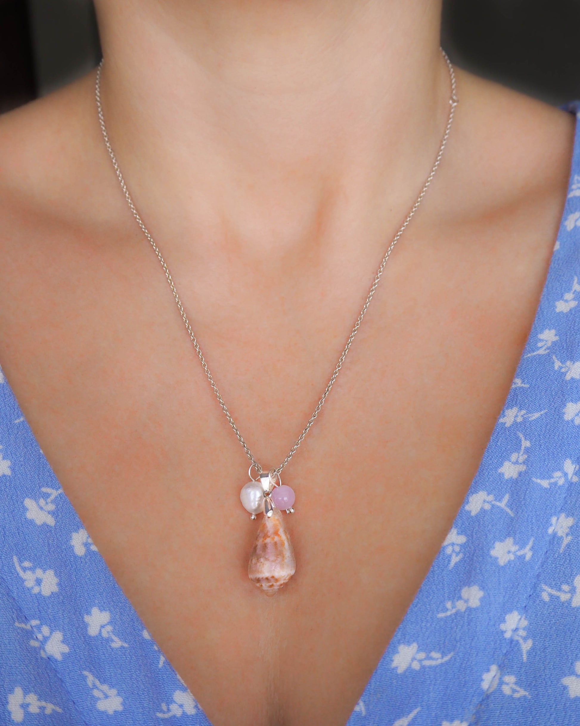 Model wearing Rose Quartz Gemstone Elegance, Captivating close-up of the Rose Quartz gemstone pendant, showcasing its soft pink tones and romantic allure in the 925 silver necklace ensemble