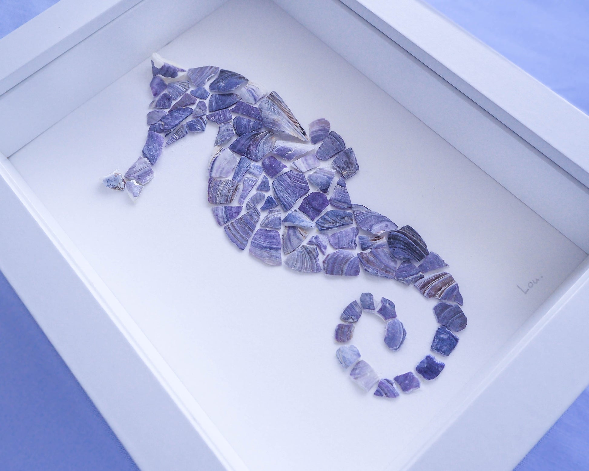 Left view of artwork in the shape of a seahorse made of mussel shells by Seabylou - Sea by Lou
