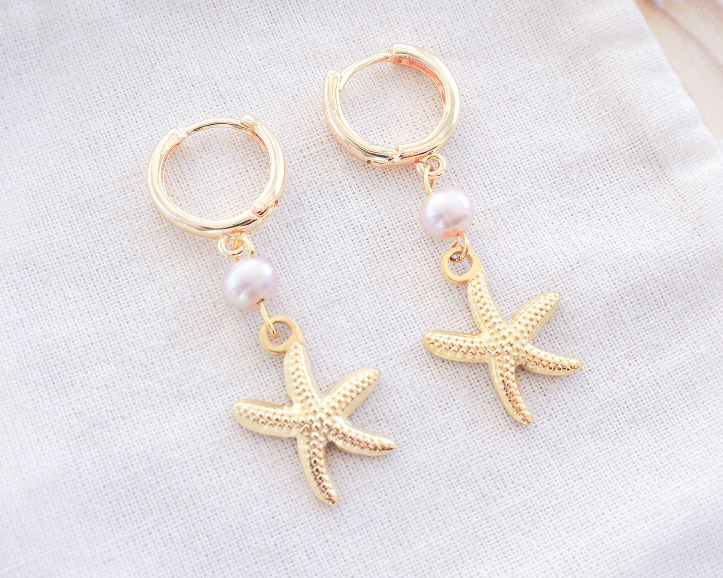 Close-up of Gold Sea Star Freshwater Pearl Earrings with StarfishCharm , Ocean Inspired Jewelry
