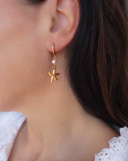 Model wearing gold Sea Star Stainless Steel Earrings with Freshwater pearl Beads and Golden Sea Star - Ocean Inspired Jewelry