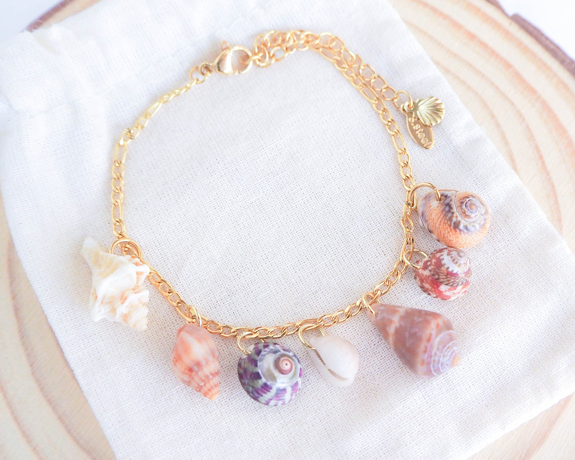 Gold Shell Charm Bracelet with 7 Tiny Shells: ocean-inspired jewelry from Portugal