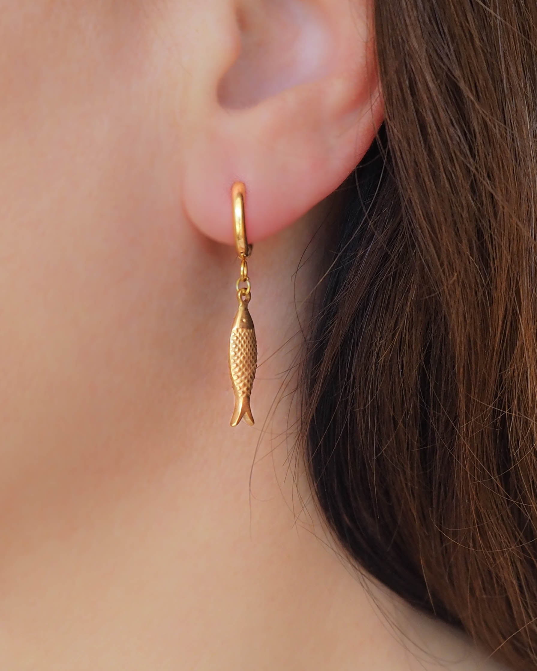 Close up of Gold Sardine Fish Earrings