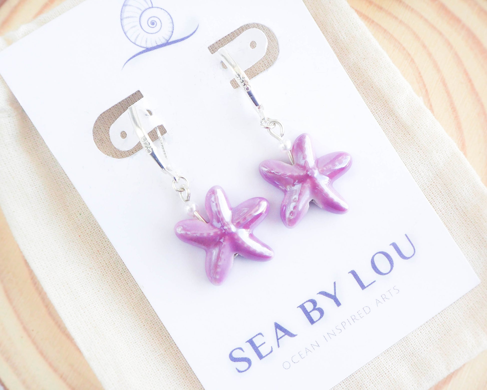 Lilac Purple Sea Star Earrings made with 925 sterling silver on display