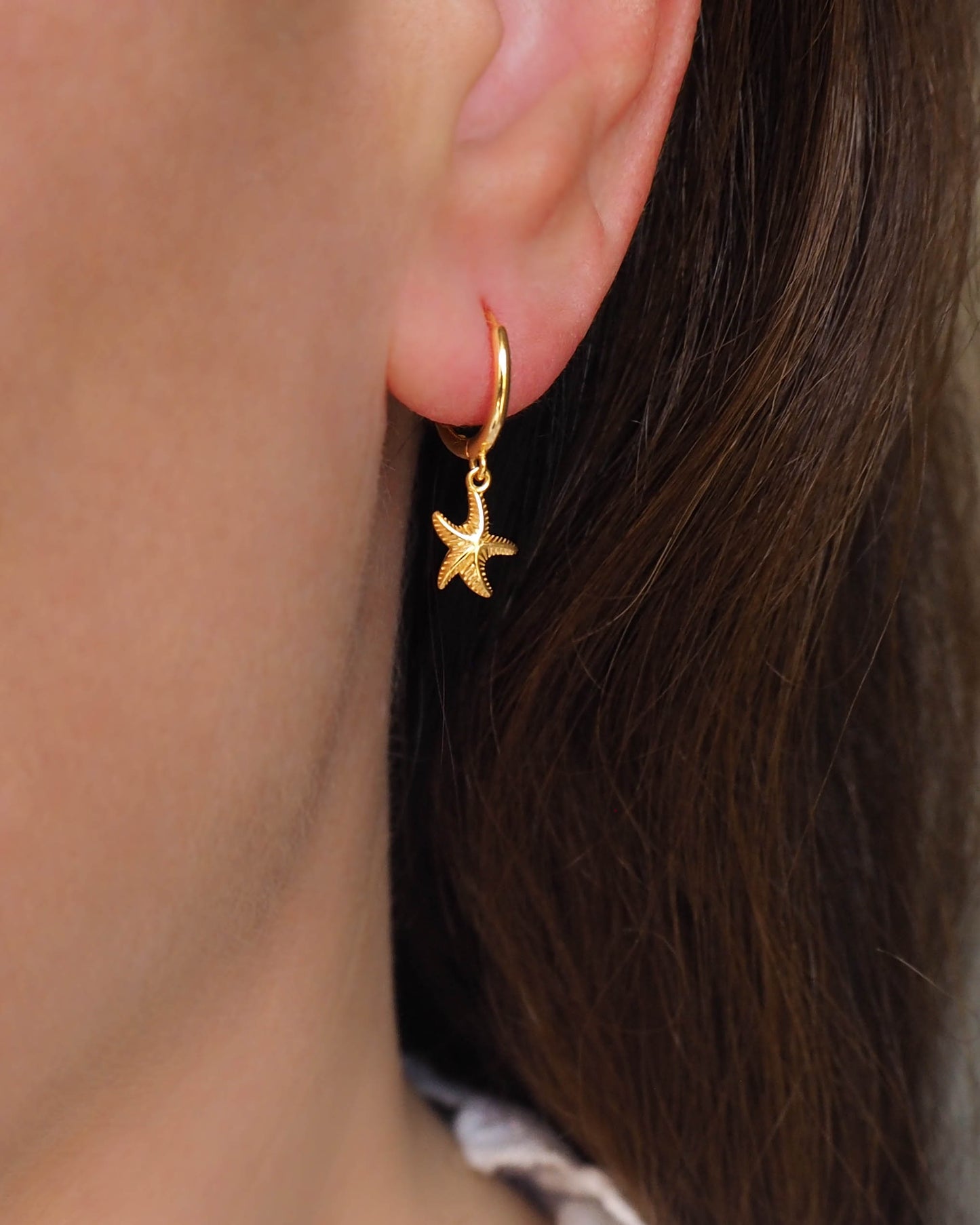 Model wearing Gold Sea Star Earrings - Starfish Jewelry