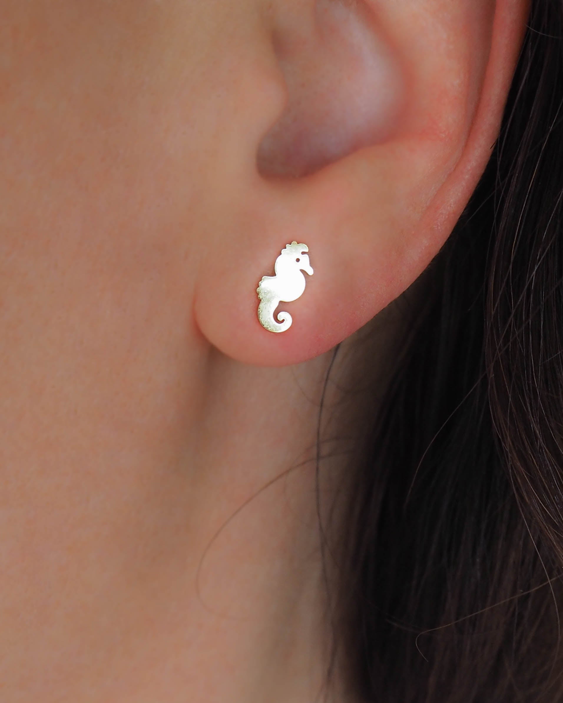 Model wearing Gold Seahorse Stud Earrings, Stainless Steel Hippocampus