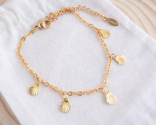 Golden Tiny Shell Charm Bracelet on display, seabylou, sea by lou