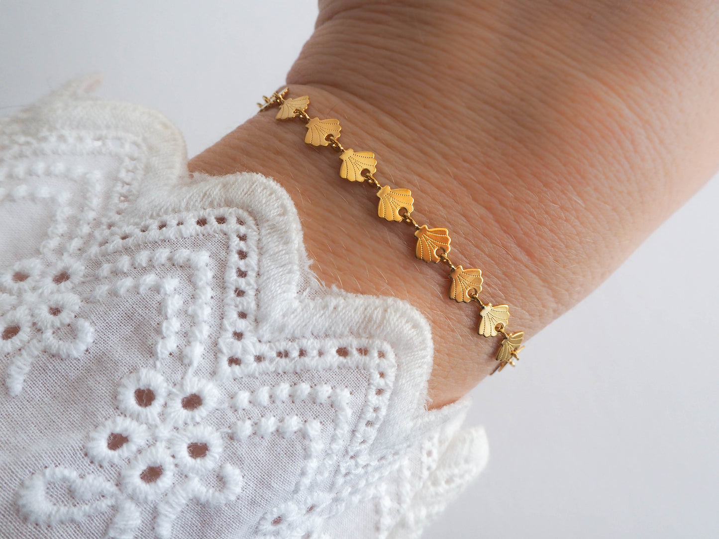 Golden seashell bracelet on model