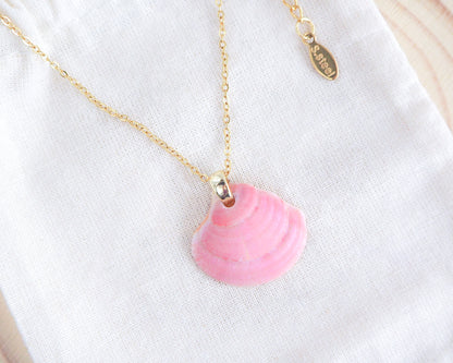 Pink Venus Shell Gold Necklace on display, seabylou