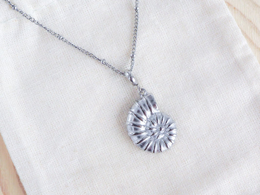 Silver Nautilus Seashell Necklace, Seabylou pendant on display