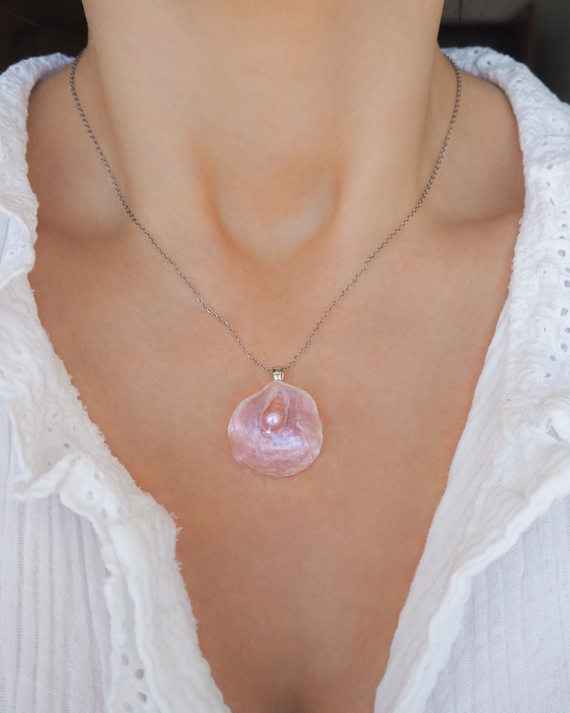 Pink Jingle Shell Silver Necklace with freshwater pearl, Mother of Pearl Pendant on model