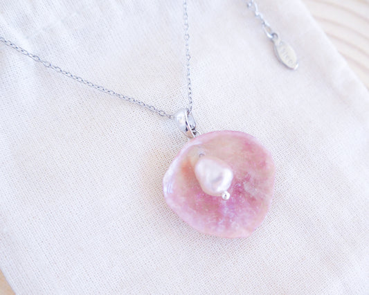 Silver Necklace with Pink Jingle Shell freshwater pearl, Mother of Pearl Pendant on display