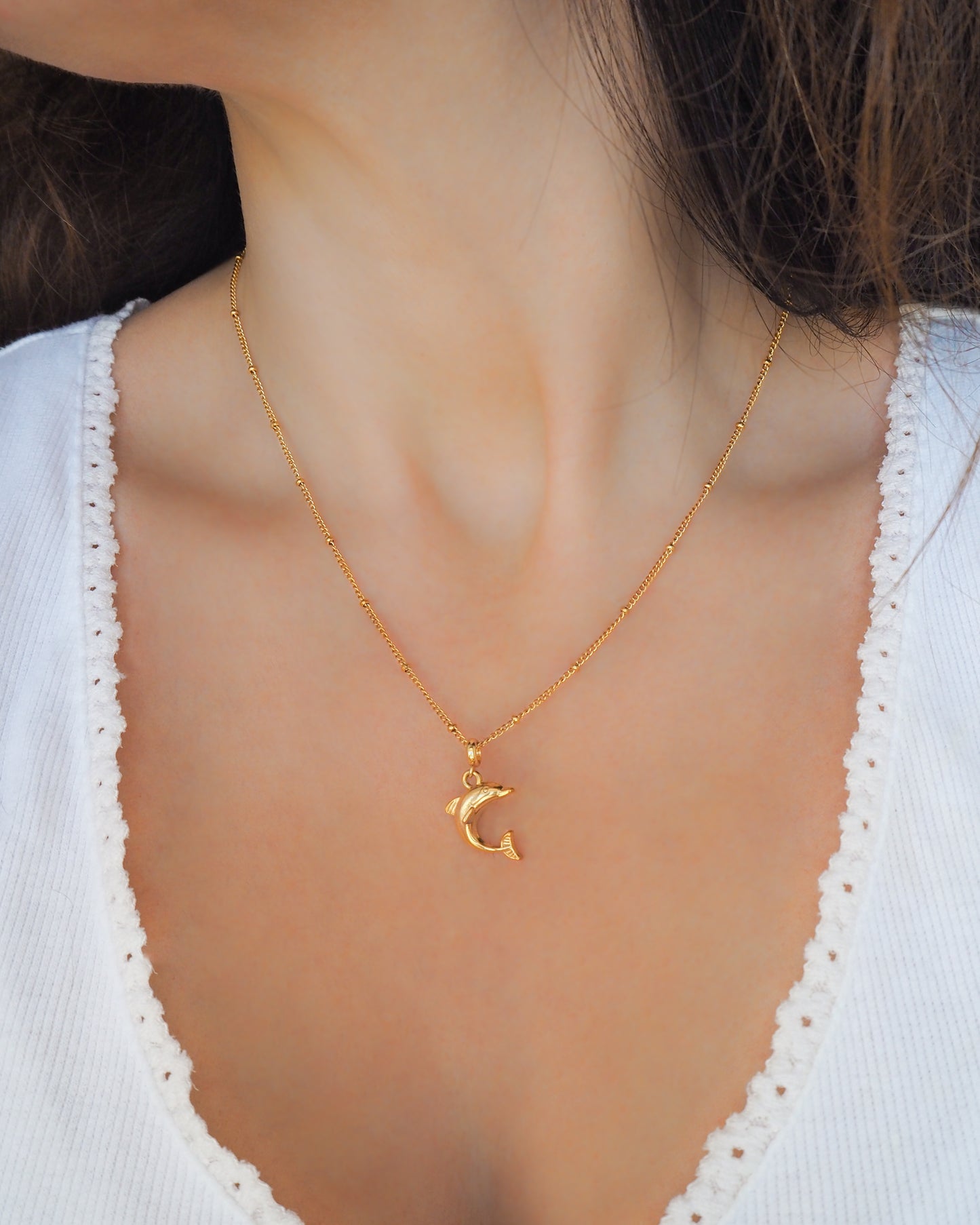 Gold Dolphin Necklace on model