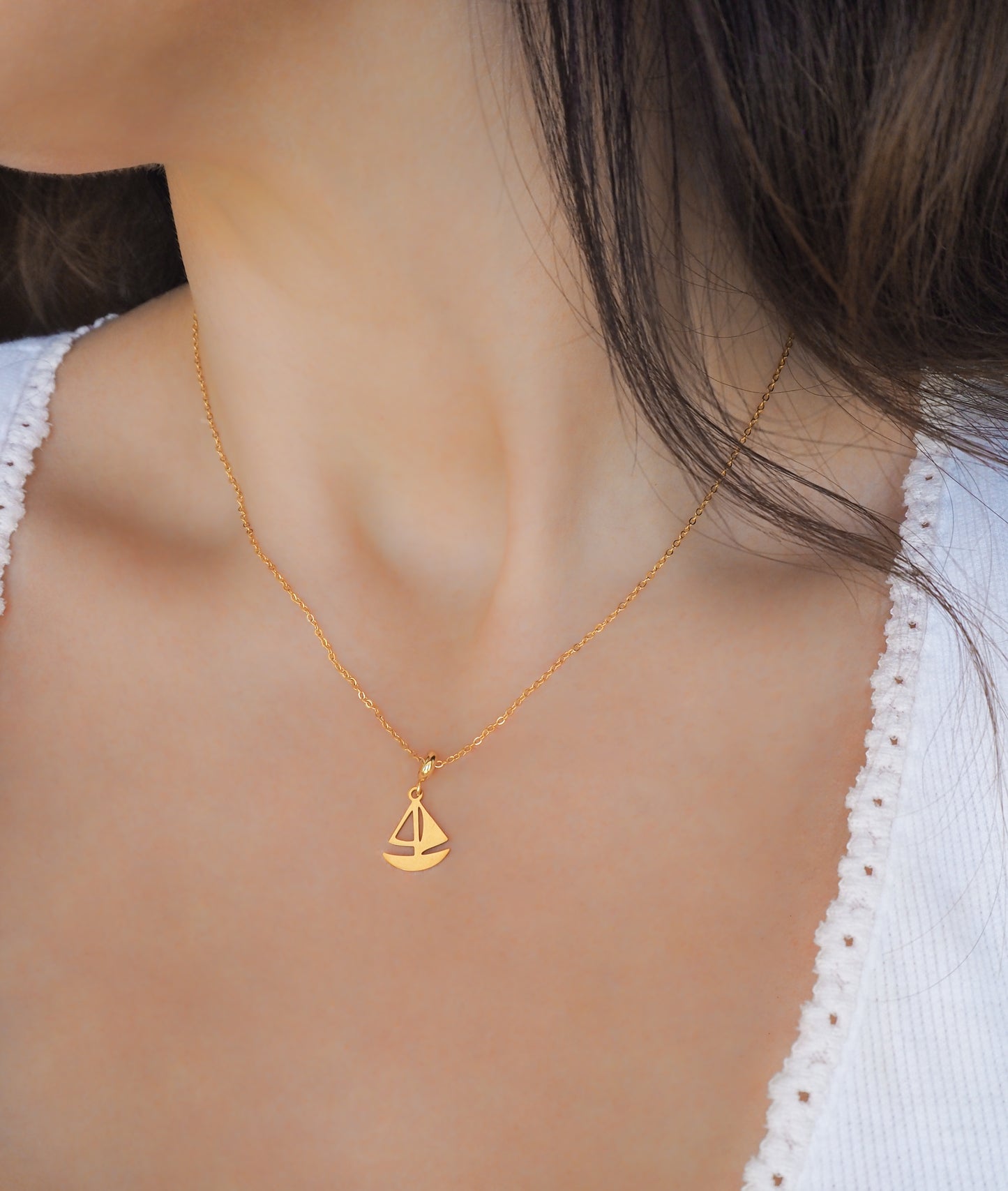 Gold Sailing Boat Necklace on model