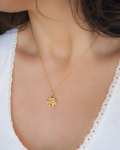 Sand Dollar Necklace Gold Chain side view on model