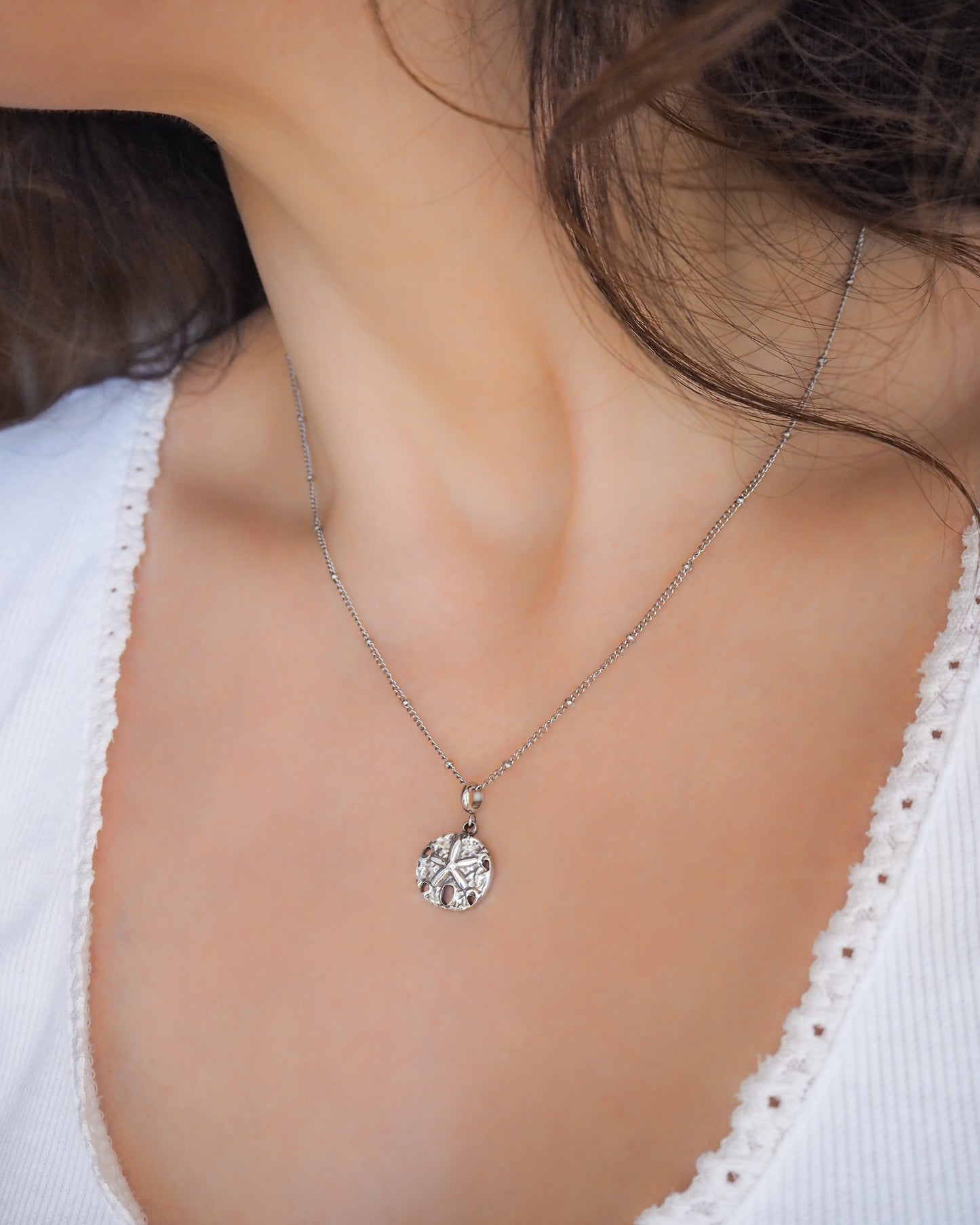 Sand Dollar Necklace in Silver on neck model