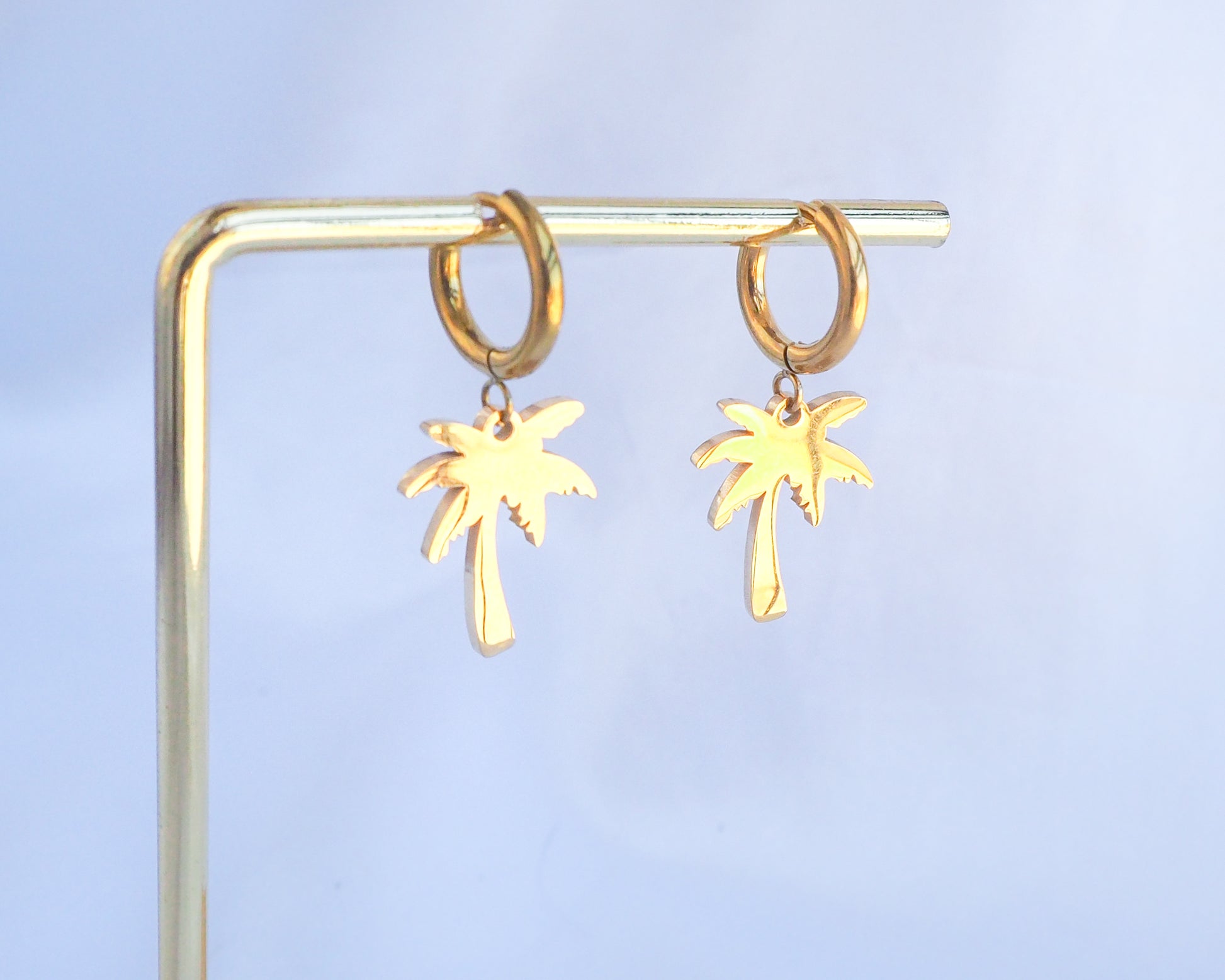 Gold Palm Earrings, Tropical Palm Tree Hoop Huggies on display