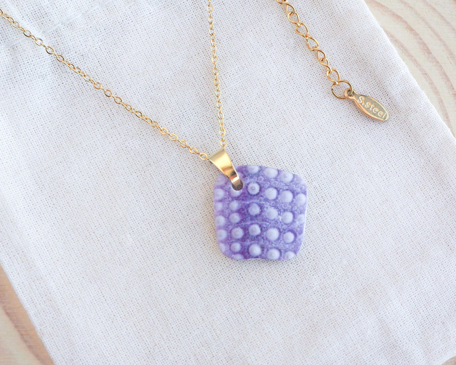 Purple Sea Urchin Necklace, Sea Urchin Jewelry, Lilac Purple Sea Urchin  Gold Necklace on display