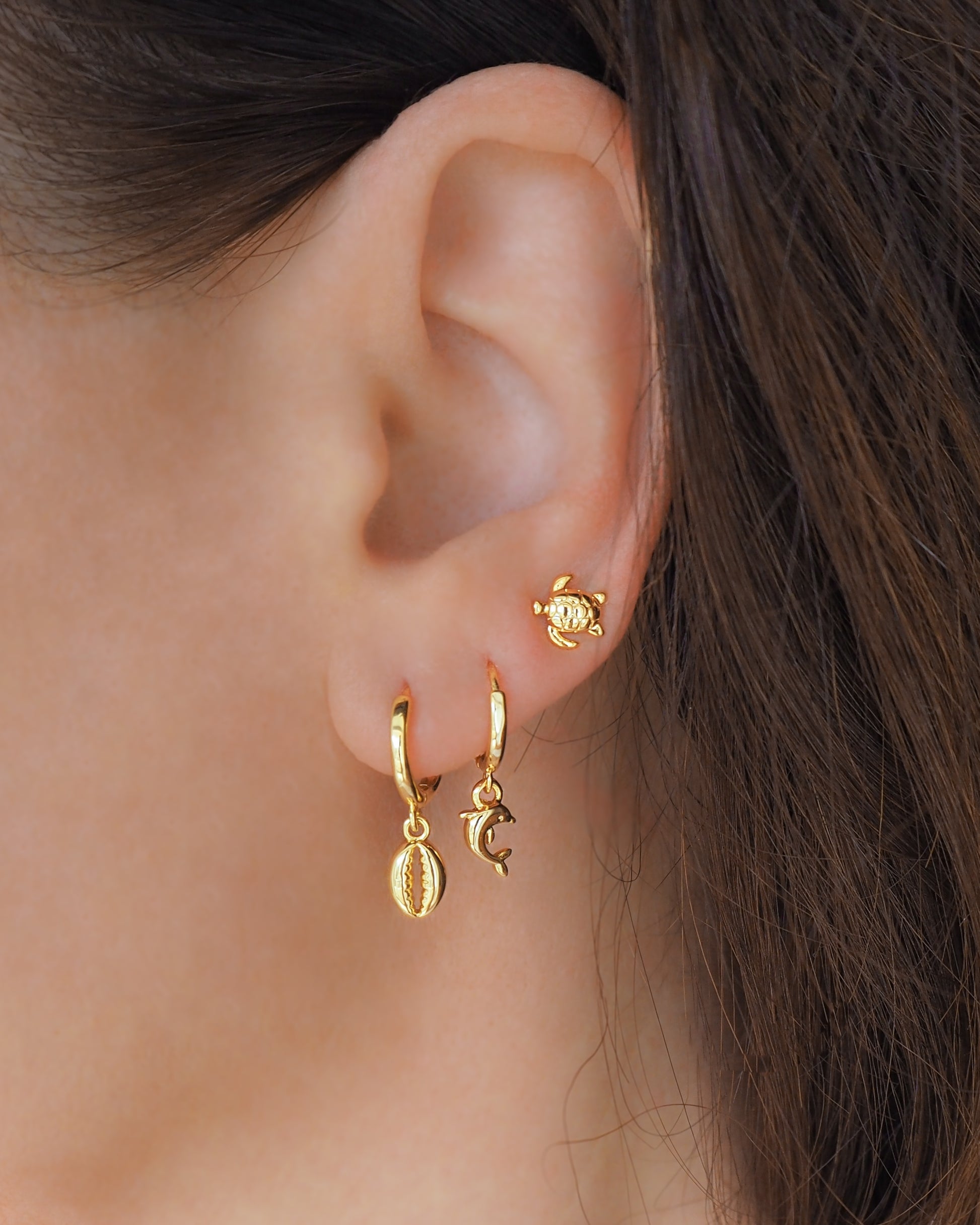 Gold Cowrie Earrings in ear, 14k gold vermeil hoop earrings, mix match ocean jewelry