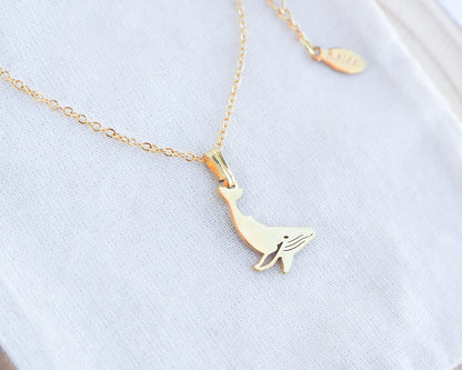 Gold Whale Necklace on display, Gold Plated Waterproof Ocean Inspired jewelry