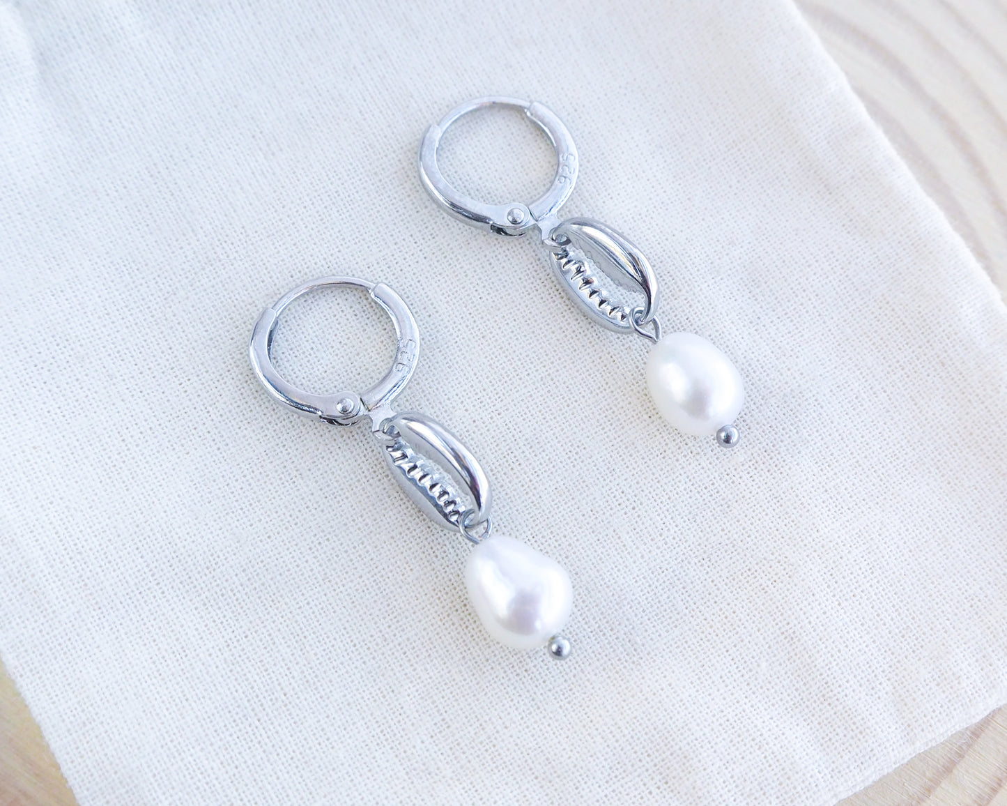 silver cowrie earrings with freshwater pearls