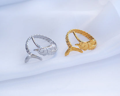 Silver and Gold Swordfish Rings on display